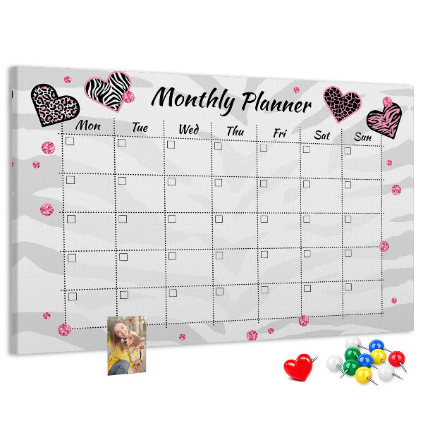 Tablero de anuncios planificador mensual con diseño de corazones y patrones