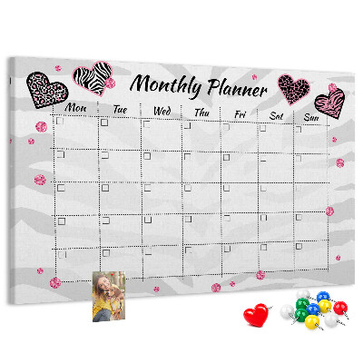 Tablero de anuncios planificador mensual con diseño de corazones y patrones