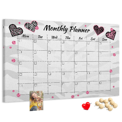 Tablero de anuncios planificador mensual con diseño de corazones y patrones