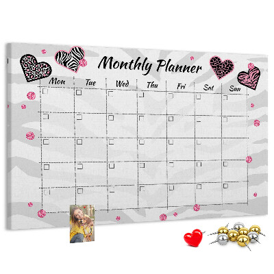 Tablero de anuncios planificador mensual con diseño de corazones y patrones