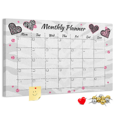 Tablero de anuncios planificador mensual con diseño de corazones y patrones