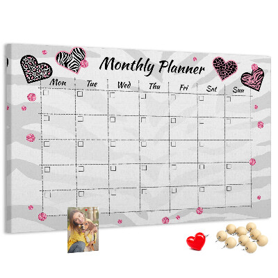 Tablero de anuncios planificador mensual con diseño de corazones y patrones