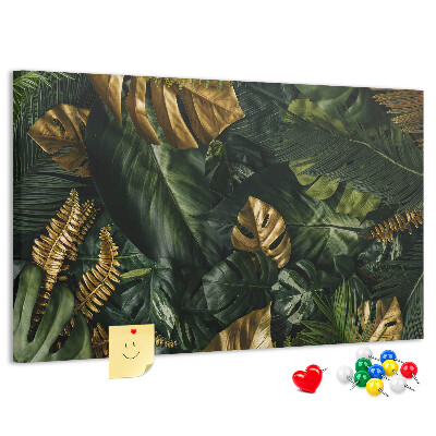 Tablero de corcho decorado con diseño de hojas doradas sobre fondo verde oscuro