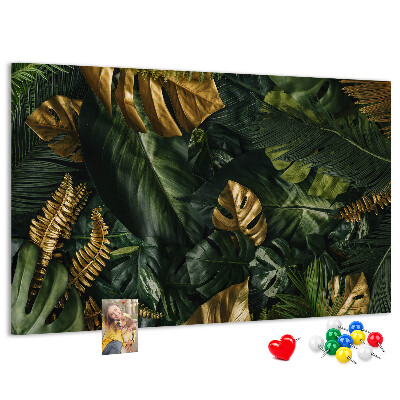 Tablero de corcho decorado con diseño de hojas doradas sobre fondo verde oscuro