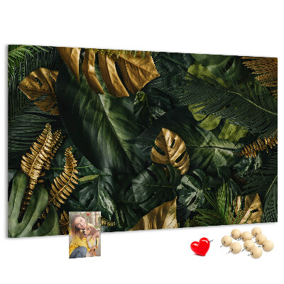 Tablero de corcho decorado con diseño de hojas doradas sobre fondo verde oscuro