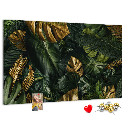 Tablero de corcho decorado con diseño de hojas doradas sobre fondo verde oscuro