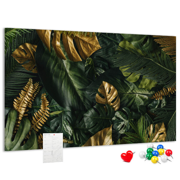 Tablero de corcho decorado con diseño de hojas doradas sobre fondo verde oscuro