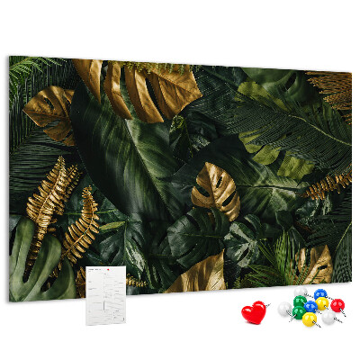 Tablero de corcho decorado con diseño de hojas doradas sobre fondo verde oscuro