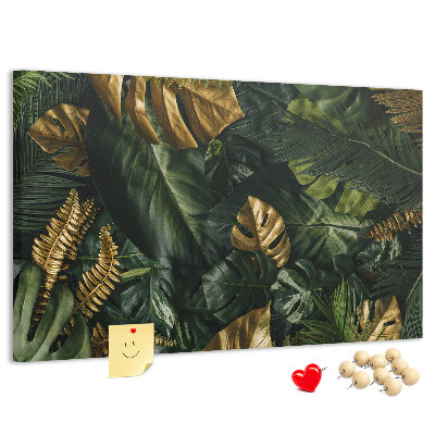 Tablero de corcho decorado con diseño de hojas doradas sobre fondo verde oscuro