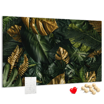 Tablero de corcho decorado con diseño de hojas doradas sobre fondo verde oscuro