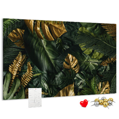 Tablero de corcho decorado con diseño de hojas doradas sobre fondo verde oscuro