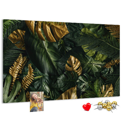 Tablero de corcho decorado con diseño de hojas doradas sobre fondo verde oscuro