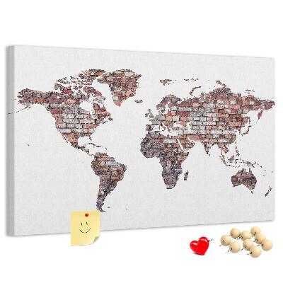 Tablero de anuncios mapamundi con fondo de pared de ladrillos