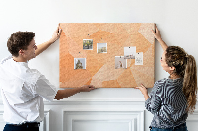 Pizarra de corcho con diseño de triángulos en tonos geométricos naranja