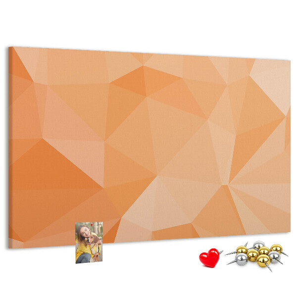 Pizarra de corcho con diseño de triángulos en tonos geométricos naranja