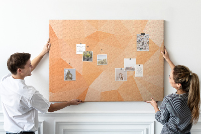 Pizarra de corcho con diseño de triángulos en tonos geométricos naranja