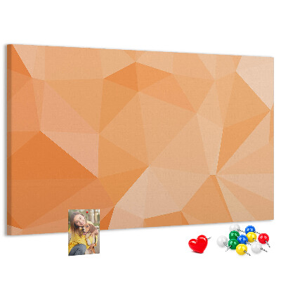 Pizarra de corcho con diseño de triángulos en tonos geométricos naranja