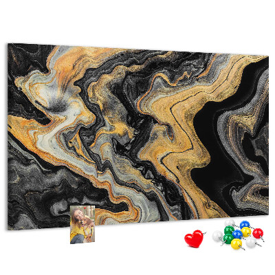 Tablero de corcho decorado con patrón abstracto de olas doradas y negras