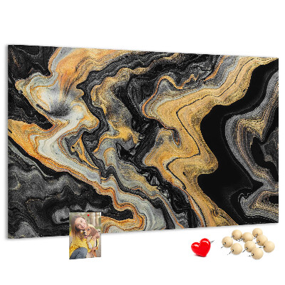 Tablero de corcho decorado con patrón abstracto de olas doradas y negras