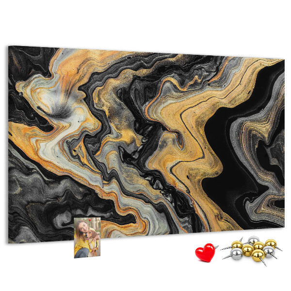 Tablero de corcho decorado con patrón abstracto de olas doradas y negras