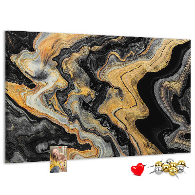 Tablero de corcho decorado con patrón abstracto de olas doradas y negras