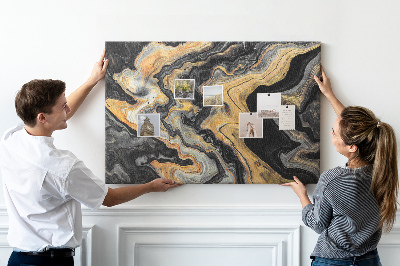 Tablero de corcho decorado con patrón abstracto de olas doradas y negras