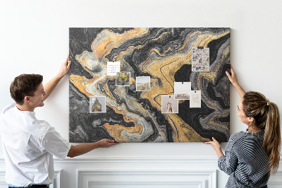 Tablero de corcho decorado con patrón abstracto de olas doradas y negras