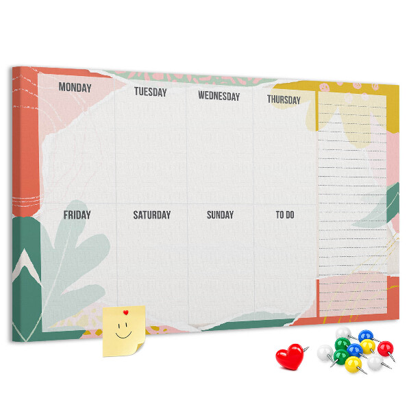Tablero de corcho decorado con diseño de calendario floral y detalles coloridos