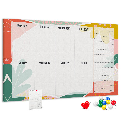 Tablero de corcho decorado con diseño de calendario floral y detalles coloridos