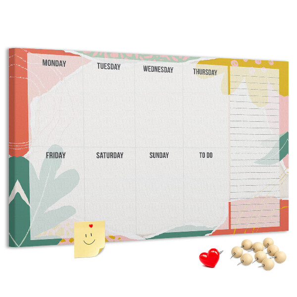 Tablero de corcho decorado con diseño de calendario floral y detalles coloridos