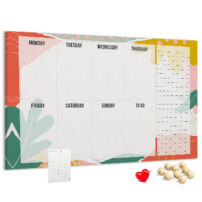 Tablero de corcho decorado con diseño de calendario floral y detalles coloridos