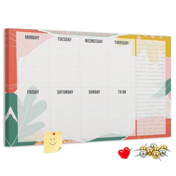 Tablero de corcho decorado con diseño de calendario floral y detalles coloridos