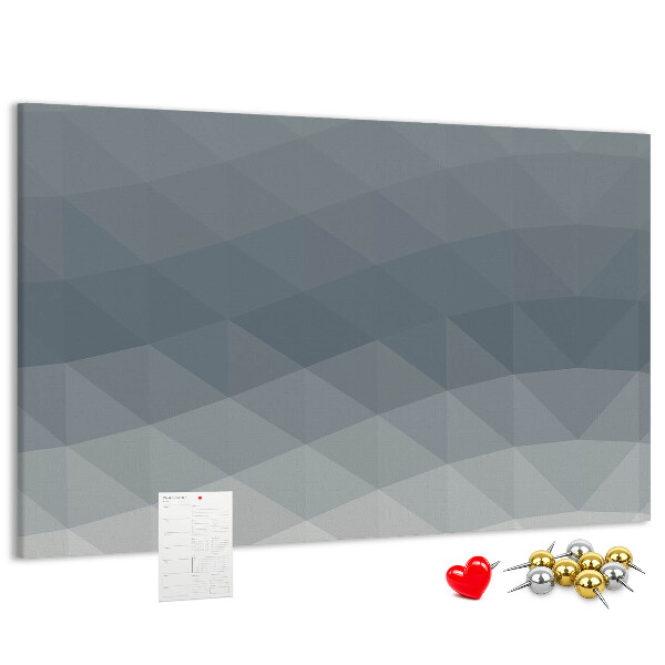 Tablero de corcho decorado con diseño de triángulos geométricos en escala de grises