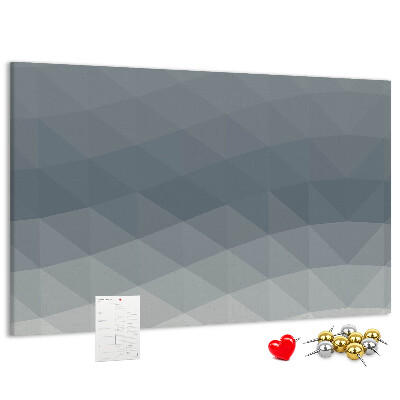 Tablero de corcho decorado con diseño de triángulos geométricos en escala de grises