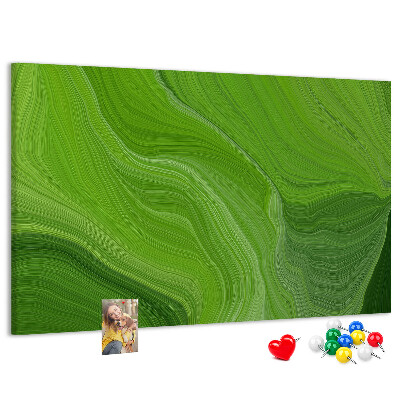 Tablero de corcho decorado con diseño de ondas verdes y líneas delicadas