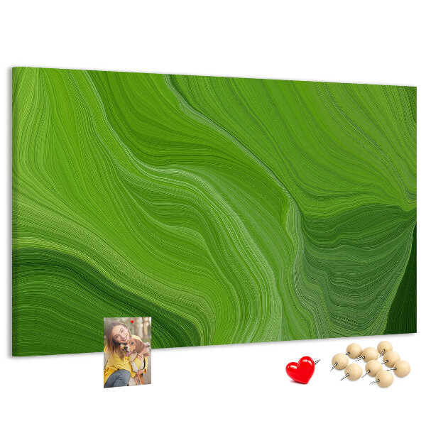 Tablero de corcho decorado con diseño de ondas verdes y líneas delicadas