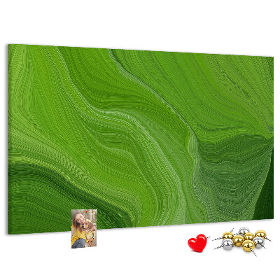 Tablero de corcho decorado con diseño de ondas verdes y líneas delicadas