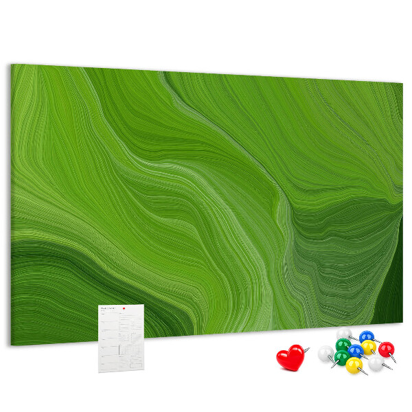Tablero de corcho decorado con diseño de ondas verdes y líneas delicadas