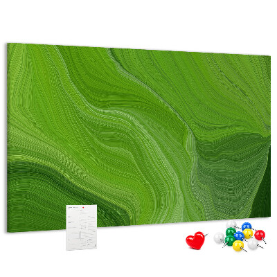 Tablero de corcho decorado con diseño de ondas verdes y líneas delicadas