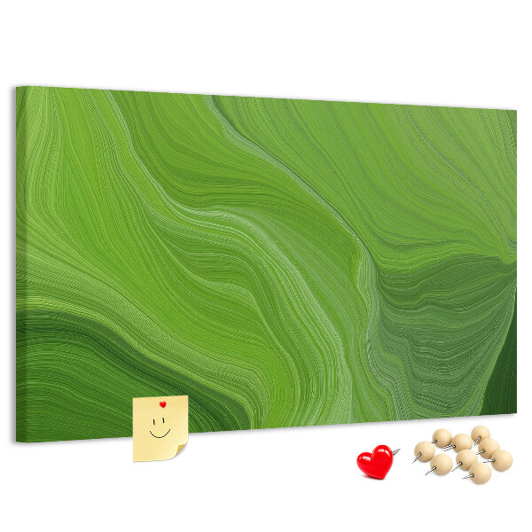 Tablero de corcho decorado con diseño de ondas verdes y líneas delicadas