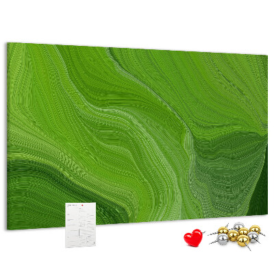 Tablero de corcho decorado con diseño de ondas verdes y líneas delicadas