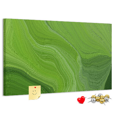 Tablero de corcho decorado con diseño de ondas verdes y líneas delicadas