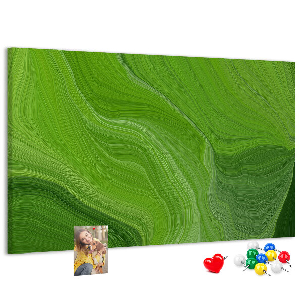 Tablero de corcho decorado con diseño de ondas verdes y líneas delicadas