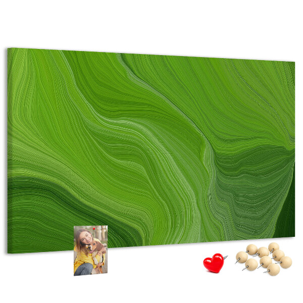 Tablero de corcho decorado con diseño de ondas verdes y líneas delicadas