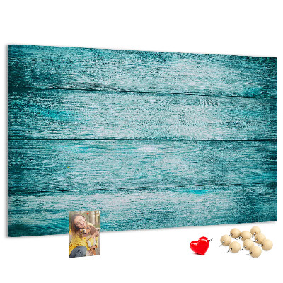 Tablero de corcho decorativo con diseño de tablones de madera en tonos verdes y azules
