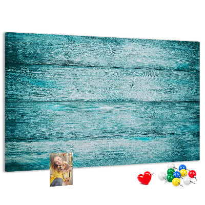 Tablero de corcho decorativo con diseño de tablones de madera en tonos verdes y azules