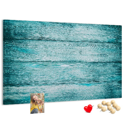 Tablero de corcho decorativo con diseño de tablones de madera en tonos verdes y azules
