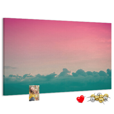 Pizarra de corcho con diseño de atardecer sobre las nubes en tonos pastel