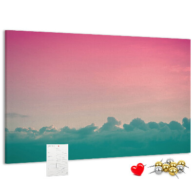 Pizarra de corcho con diseño de atardecer sobre las nubes en tonos pastel