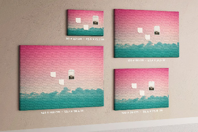 Pizarra de corcho con diseño de atardecer sobre las nubes en tonos pastel